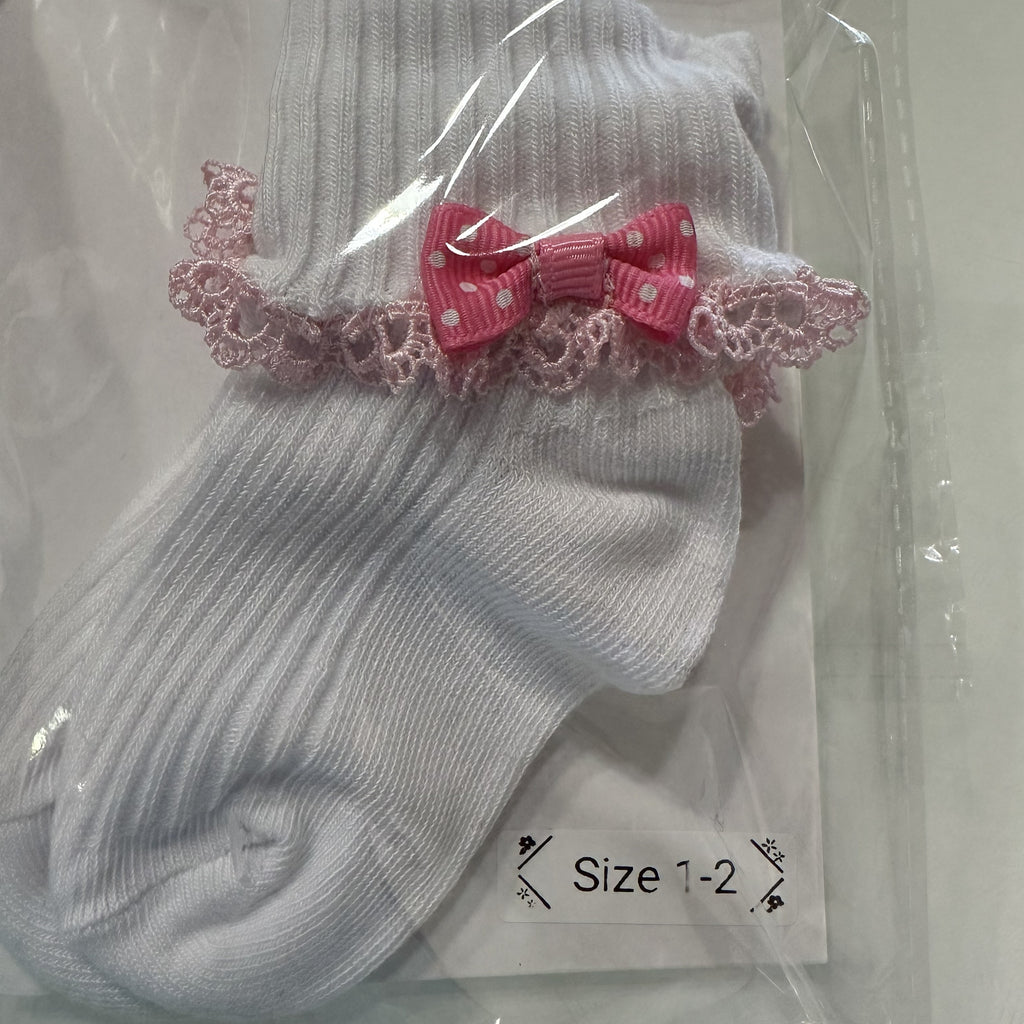 White baby cotton socks with pastel pink lace trim and pink bow.