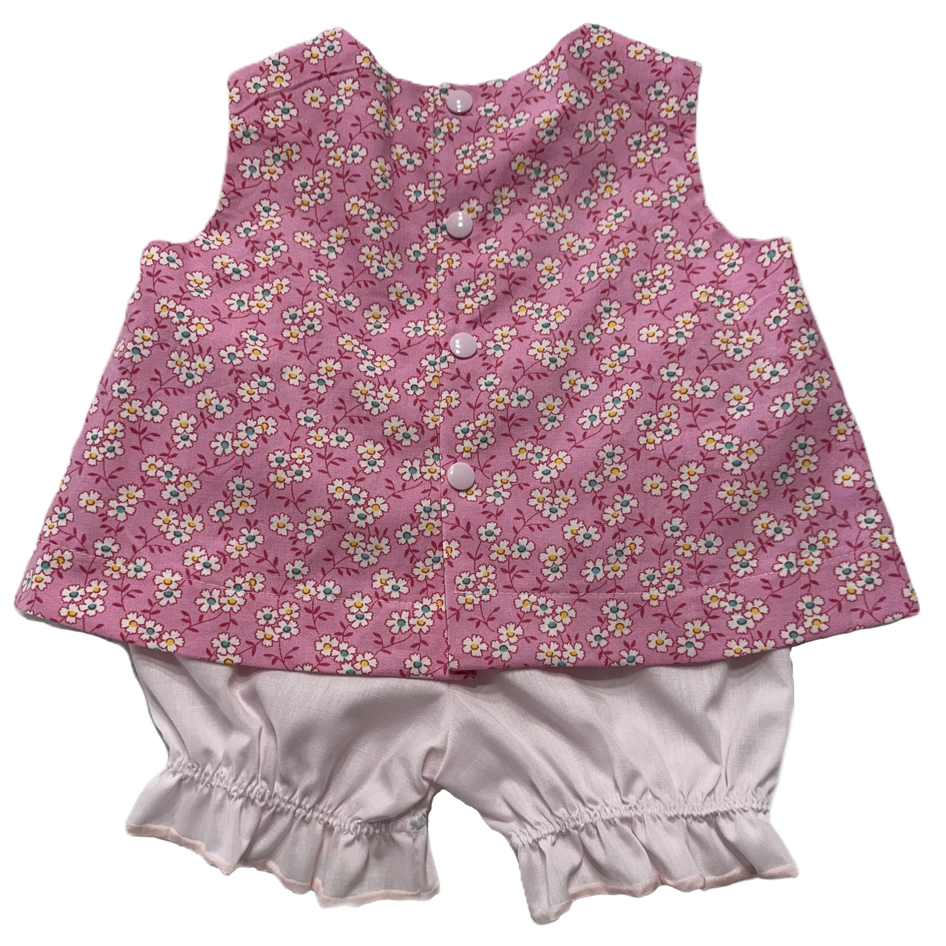 Pink floral sleeveless top and shorts set on a white background