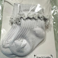 White baby cotton socks with white lace trim.