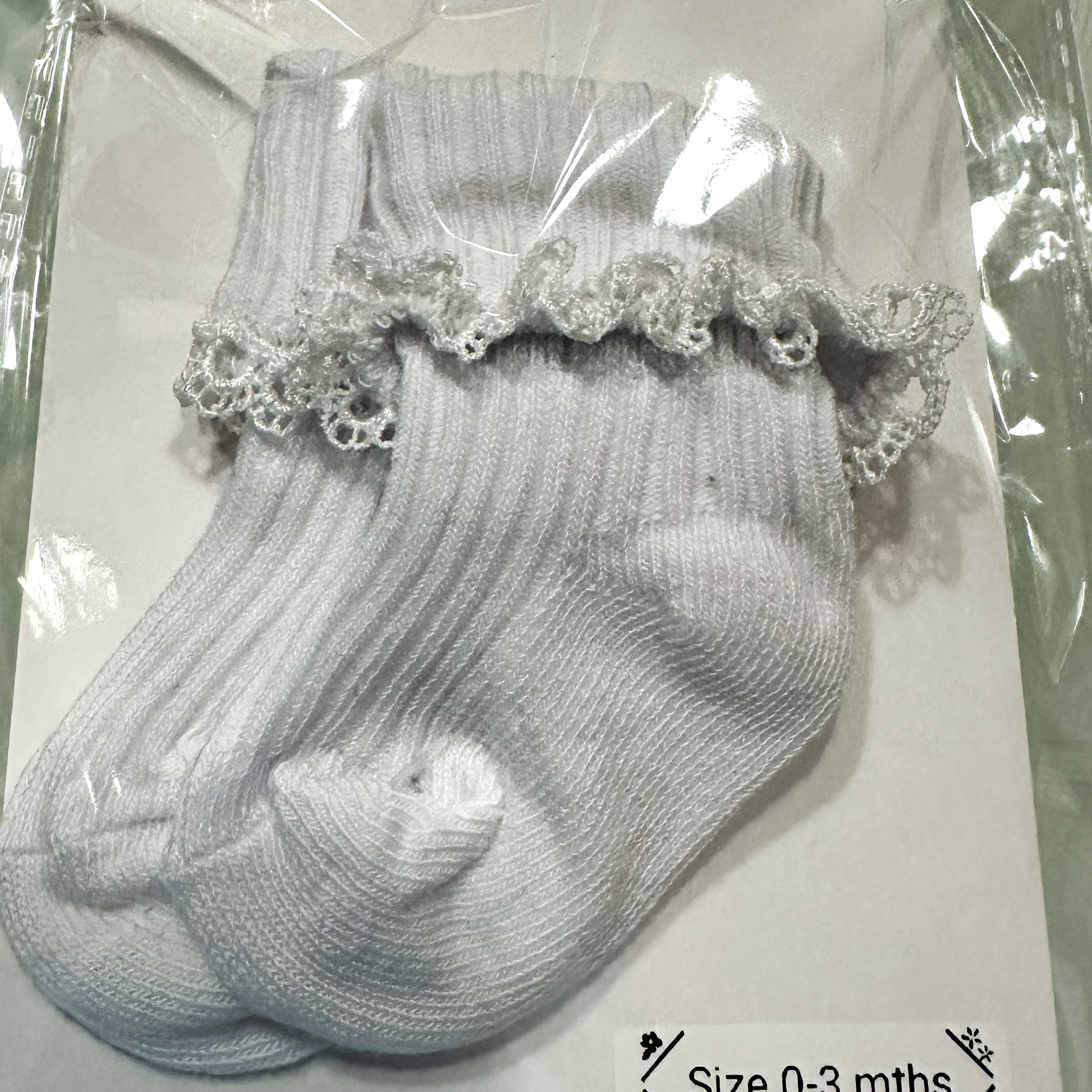 White baby cotton socks with white lace trim.