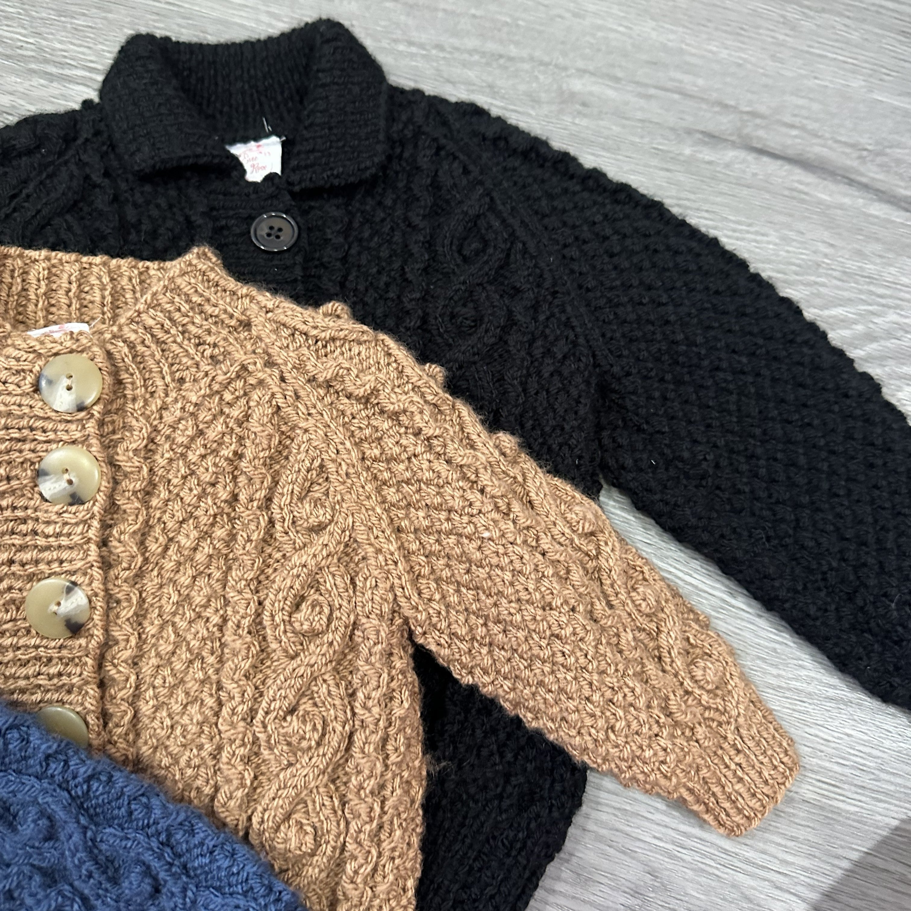Hand Knitted Aran cardigan with round neck