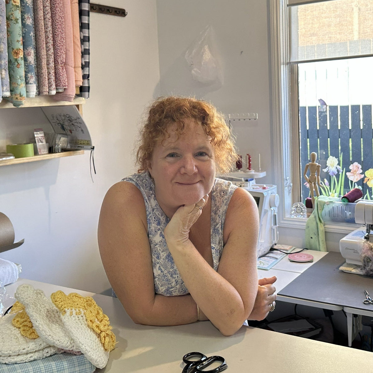 Amber in her sewing room for Evie Rose